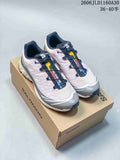 Pair of pale pink, gray, and navy Salomon XT-6 sneakers on a branded box