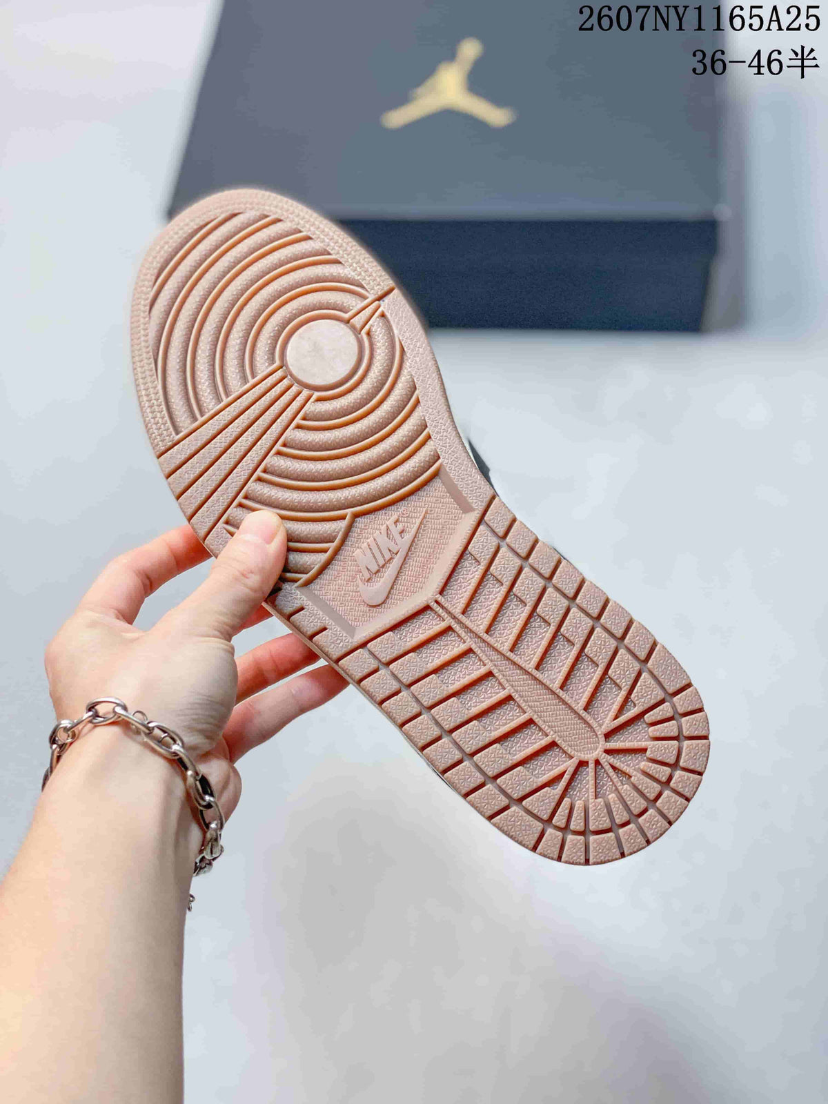 Close-up of the gum-toned outsole with circular traction grooves