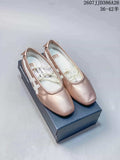 Pair of pink metallic Onitsuka Tiger Mary Jane shoes displayed on a shoe box, with the style code and size range visible above.