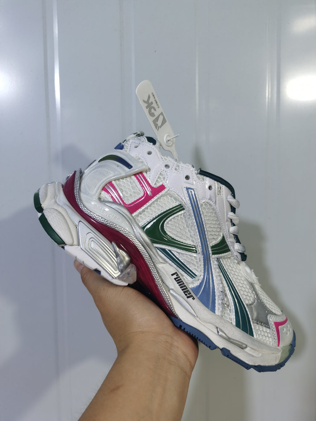 Angled close-up of the Puma 9934 sneaker highlighting the mesh panels, colored overlays, and padded heel.