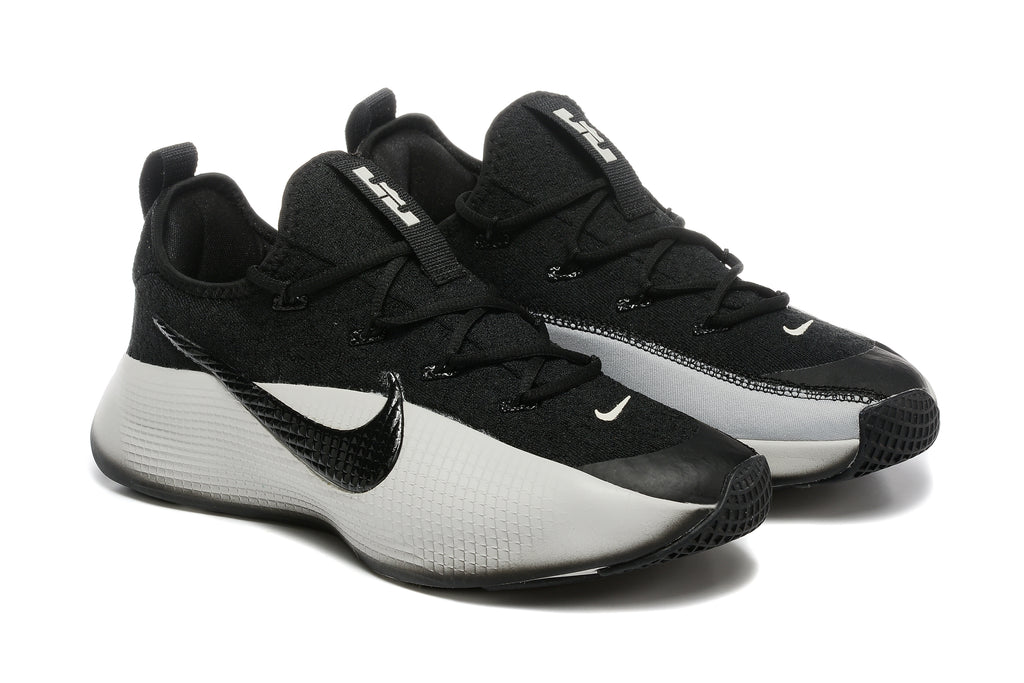 Pair of black and white training shoes shown at an angled front view.
