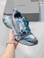 Gray and pale blue Balenciaga 3XL-style sneaker with teal accents