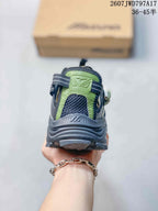 Rear view of the sneaker showing the padded heel, green heel panel, and dark outsole.