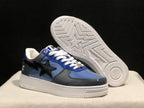 Angled view of the sneakers with one shoe lifted to reveal the patterned white outsole.
