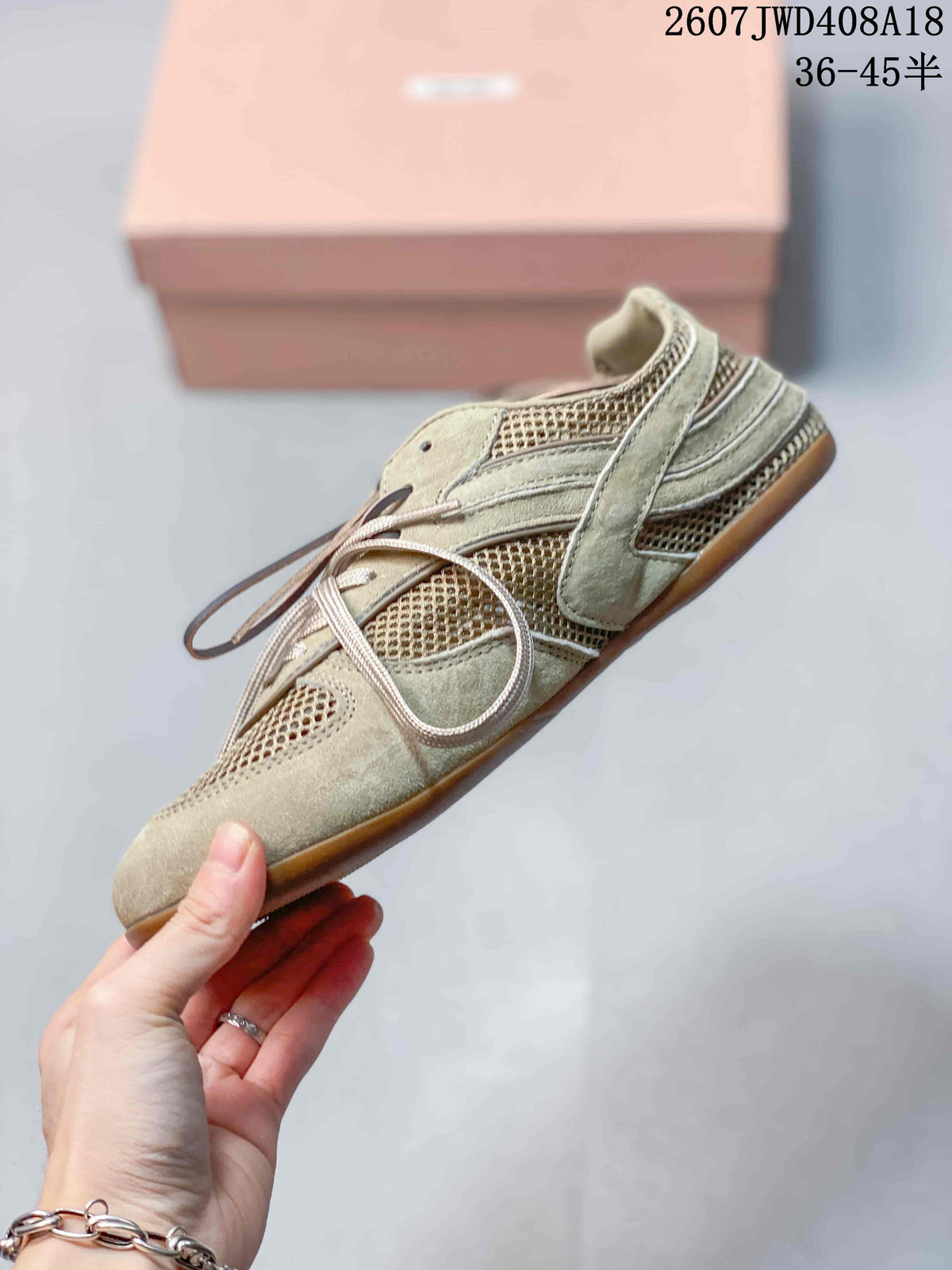 Side profile highlighting the low-top silhouette, layered panels, mesh sections, flat laces, and gum-colored outsole.