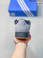 Rear view showing the grey heel, black collar and thick black midsole.