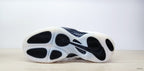 Outsole view of a Nike Air Foamposite One sneaker with black traction sections