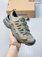 Side view of the shoe showing the olive upper, mesh panels, and dark outsole