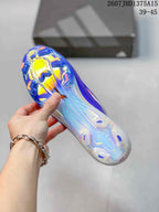 Underside view of a purple soccer cleat showing the translucent outsole and molded football studs.