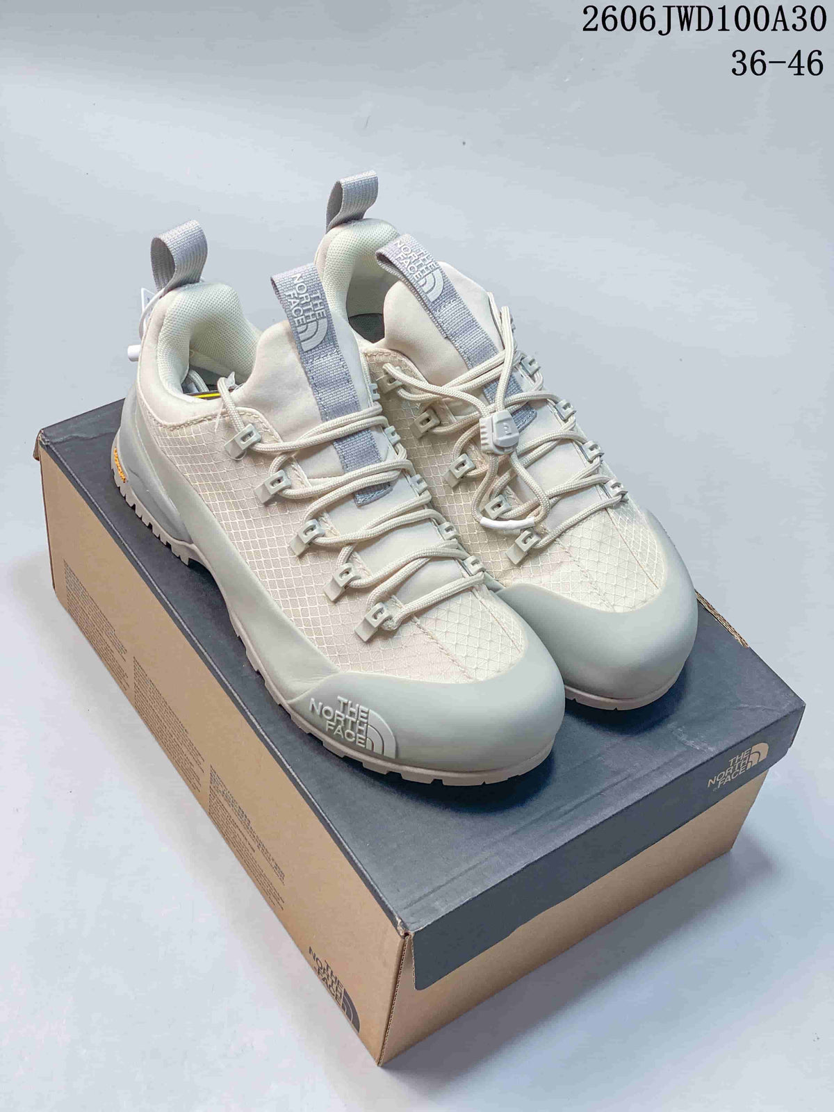 Pair of light gray and off-white The North Face GLENCLYFFE low-top outdoor shoes on a shoe box