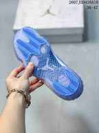 Underside view showing the translucent blue outsole and patterned traction areas of a Jordan high-top sneaker.