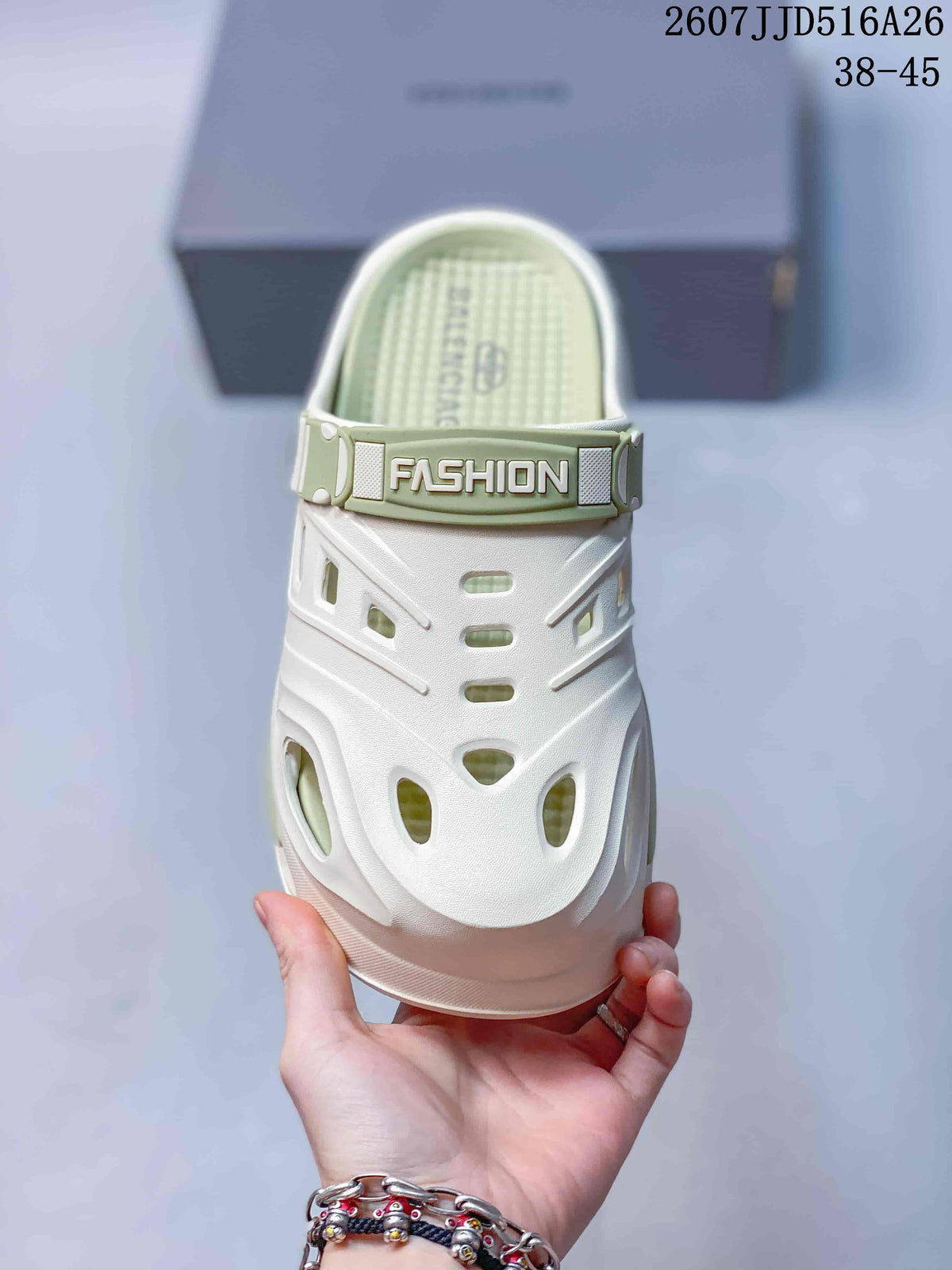 Top view showing the ventilated upper, green strap and cushioned footbed.