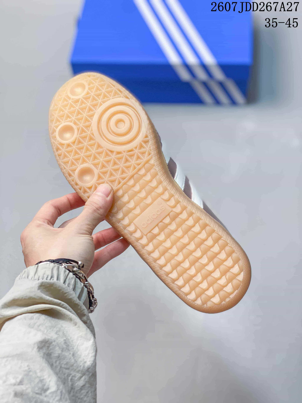 Close-up of the textured gum-colored outsole with a geometric tread pattern.