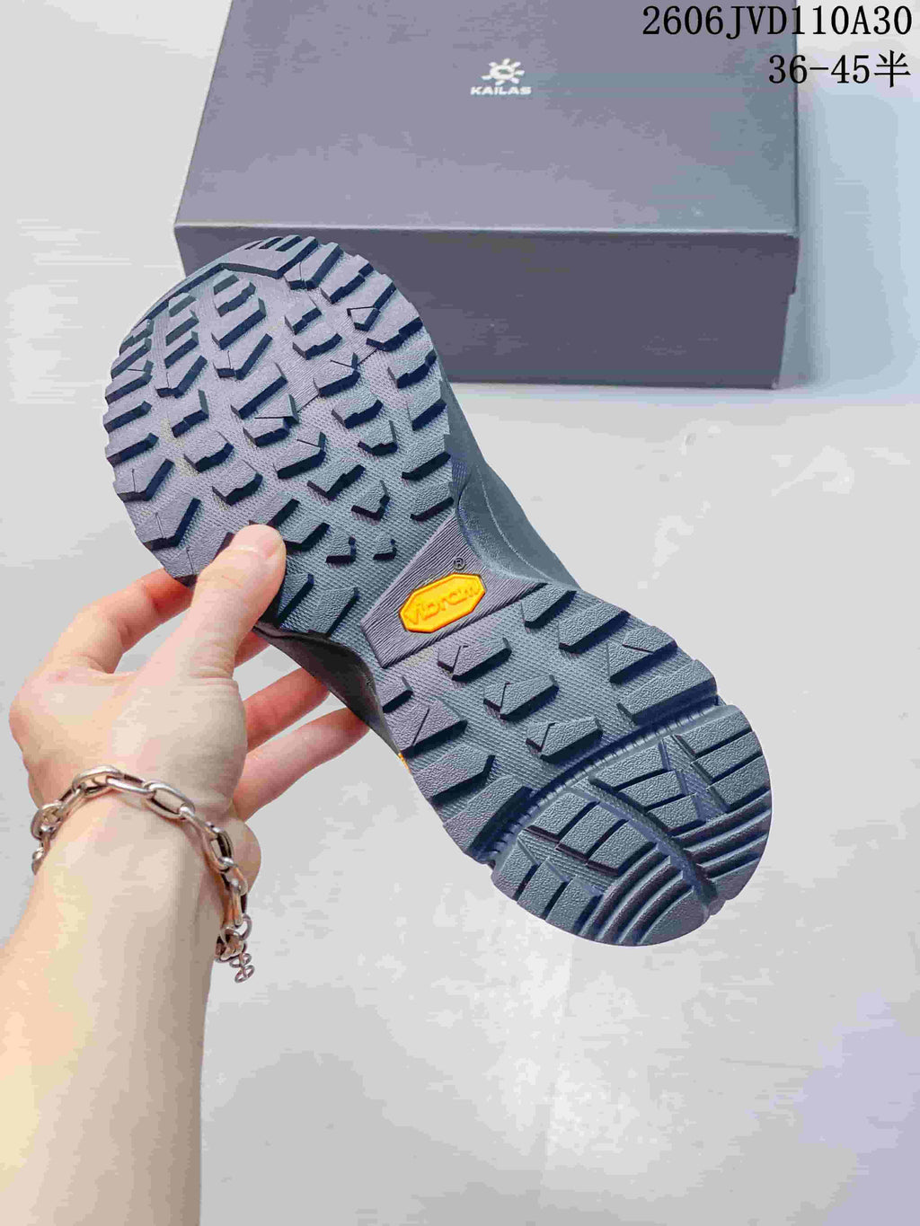 Close-up of the lugged outsole with Vibram branding