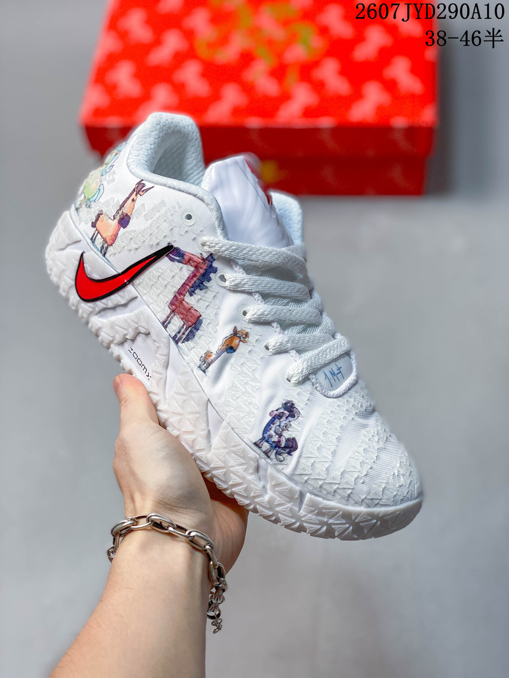Angled side view showing the red Swoosh, seasonal illustrations and white textured construction.