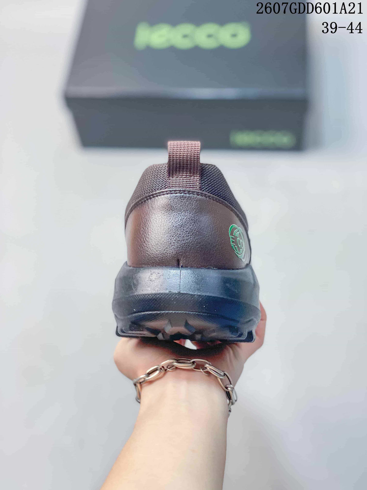 Rear view of the brown ECCO shoe showing the heel pull tab, heel logo detail, and black outsole.