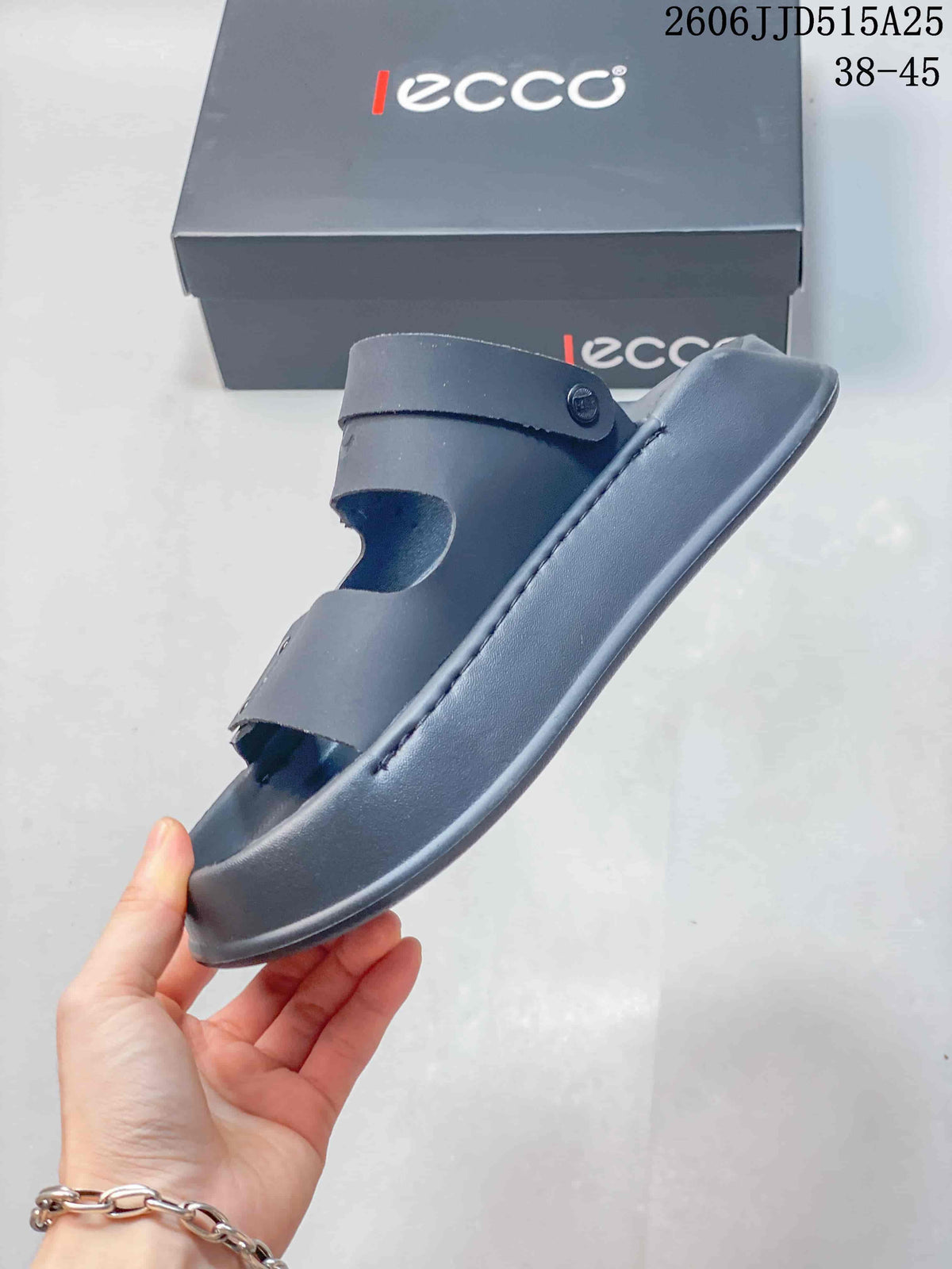 Side profile of the dark gray sandal showing the raised sole and layered upper straps.