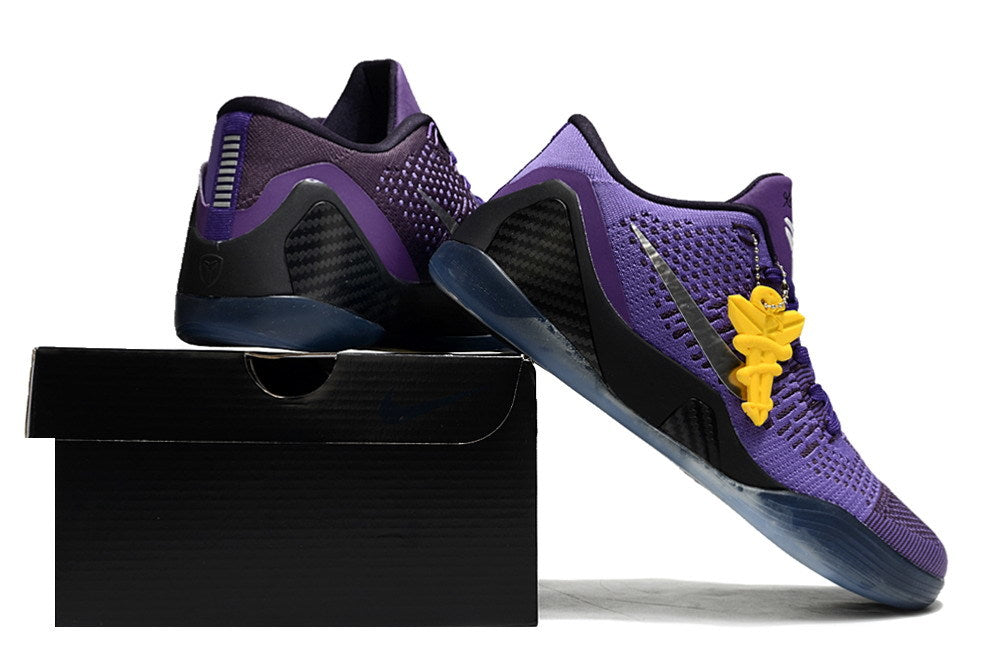 Purple shoes displayed on a black shoebox.