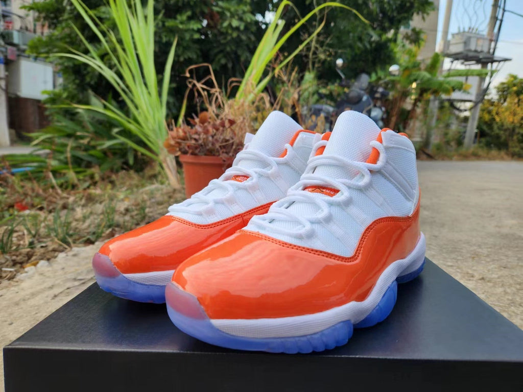 Jordan 11 White and Orange High-Top Sneakers