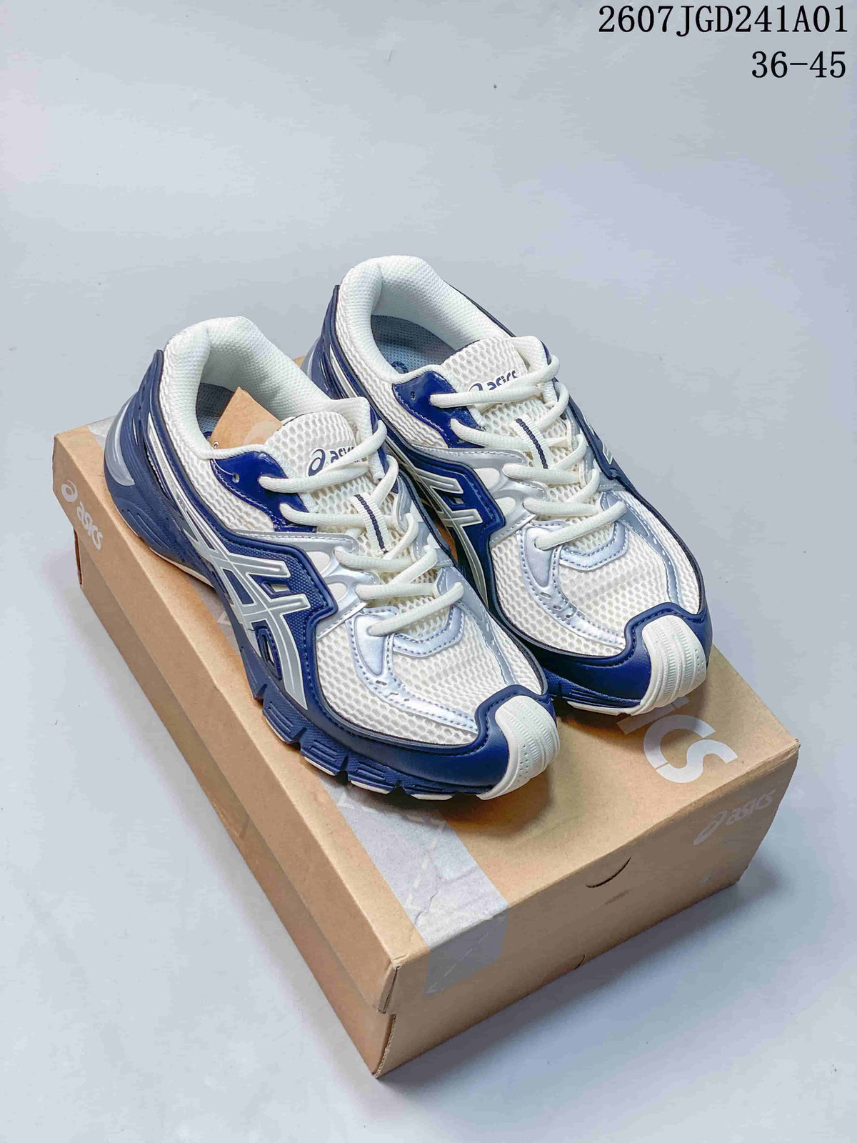 Pair of white and navy ASICS GEL-SD Lyte sneakers displayed on a shoebox