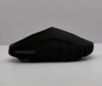 Side view of a black Nike slide sandal showing the sculpted sole and blue outsole pods.