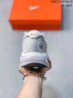 Rear view of the white and lavender Nike Journey Run sneaker showing the padded heel and layered midsole.