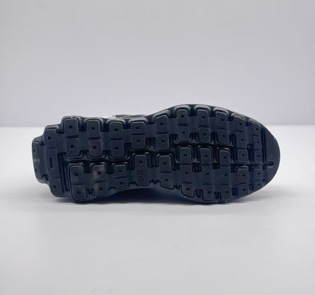 Underside view showing the segmented black rubber outsole tread.