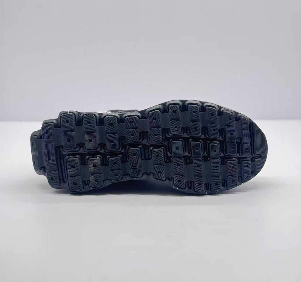 Underside view showing the segmented black rubber outsole tread.