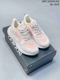 White and pale pink adidas AlphaBounce Beyond sneakers shown on a branded box