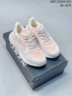 White and pale pink adidas AlphaBounce Beyond sneakers shown on a branded box