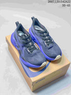 Pair of dark navy and purple ASICS GEL-NOVABLAST 5 LE running shoes displayed on an ASICS shoe box.