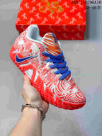 White and red Nike Ja 3 shoe with red horse-themed graphics, blue laces, and an orange striped tongue panel.