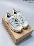 Pair of ivory Salomon XA Pro 3D Amphib low-top sneakers on a shoe box