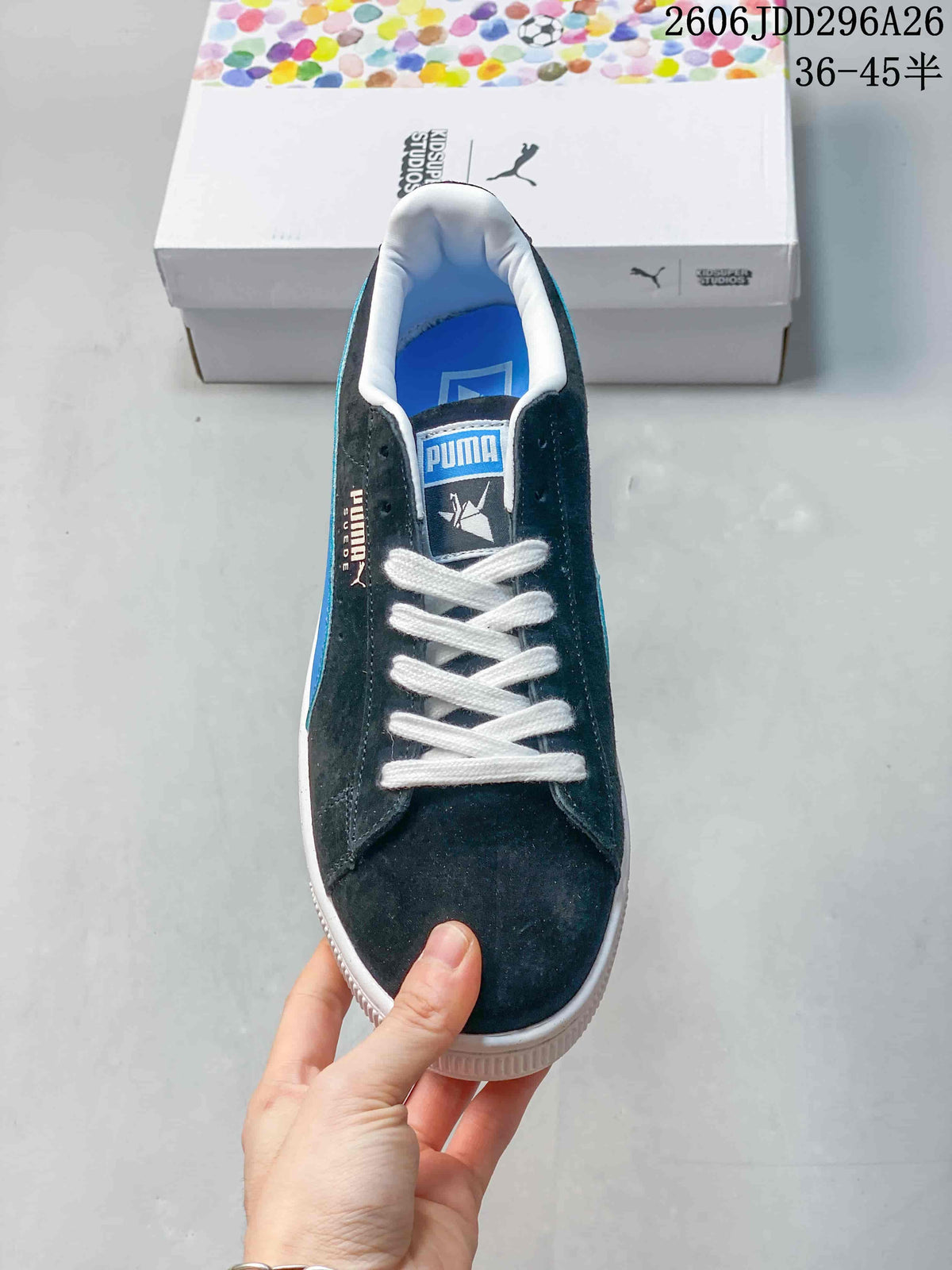 Top view showing the dark blue toe, white laces, branded tongue, and padded white collar.