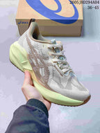 Light gray ASICS NOVABLAST 5 LE running shoe with pale green midsole