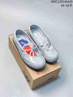 Grey New Balance Flat Breeze women's Mary Jane-style shoes displayed on a New Balance box.