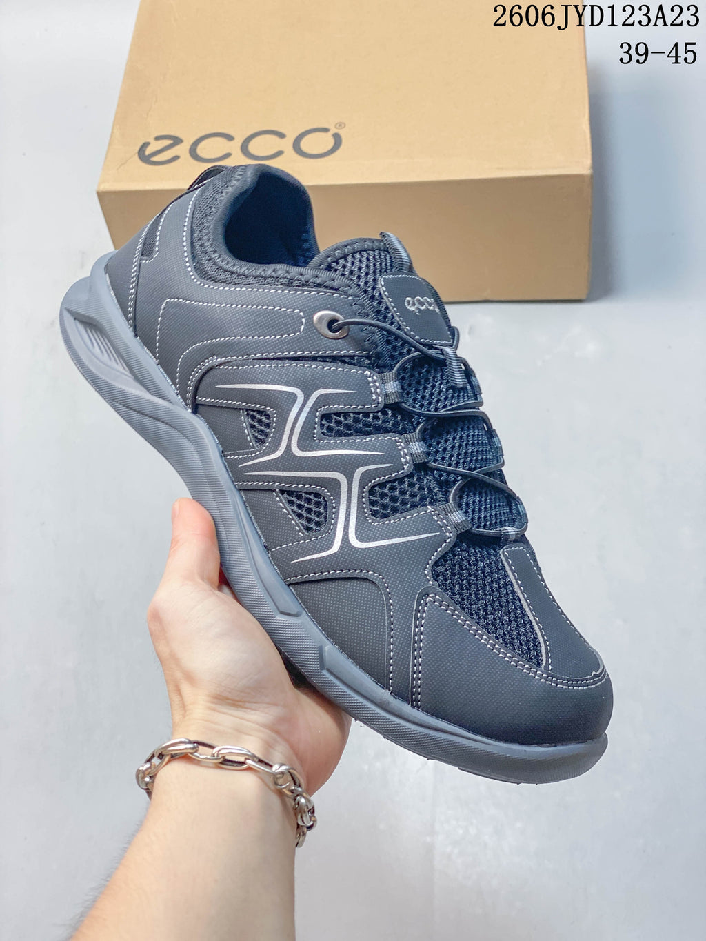 Angled side view of the gray ECCO sneaker.