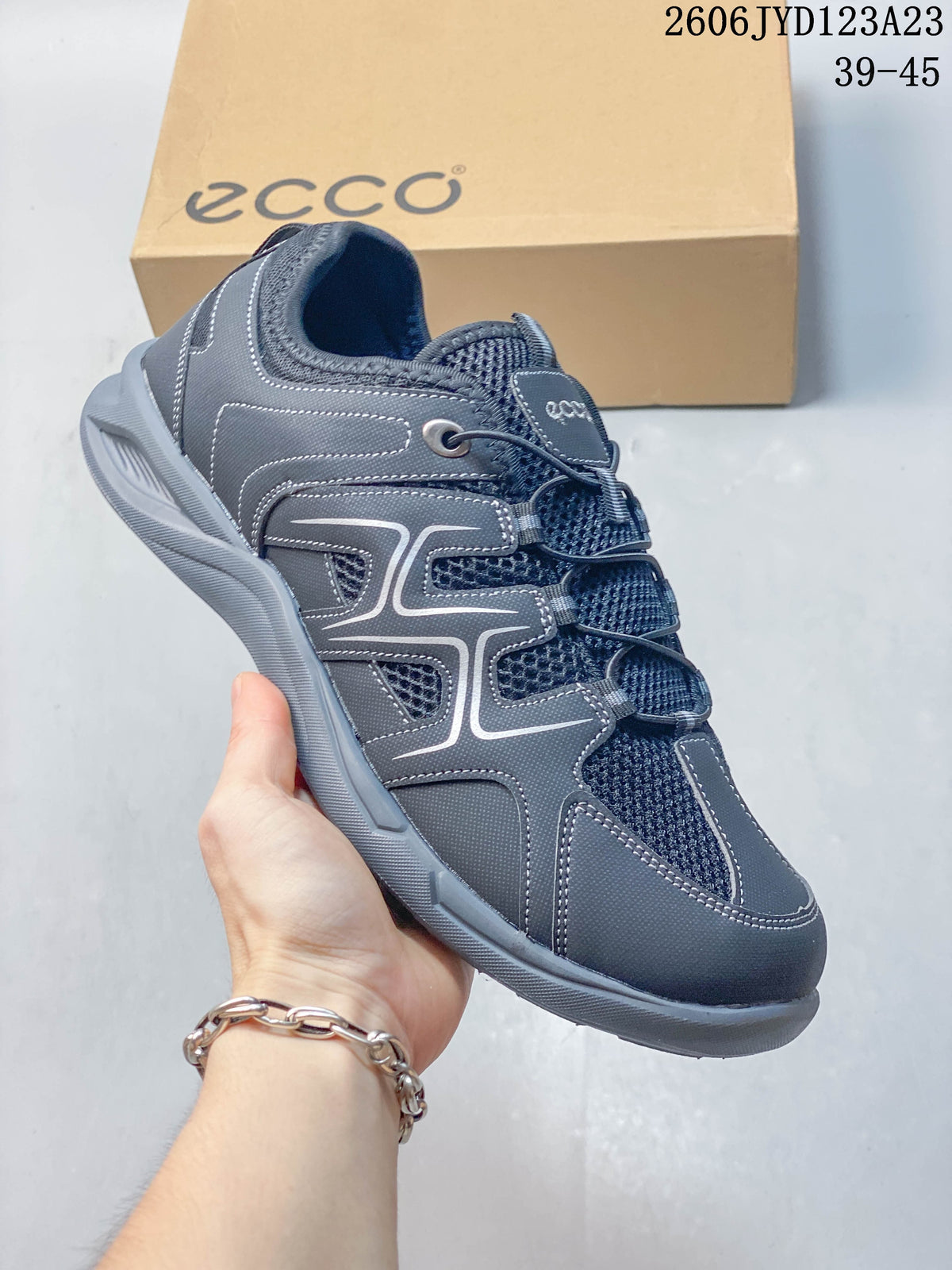 Angled side view of the gray ECCO sneaker.