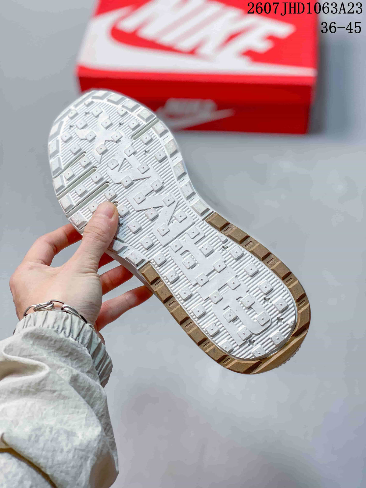 Close-up of the patterned rubber outsole with raised traction elements.