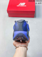 Rear view of the blue and charcoal mesh-look heel and outsole