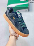 Angled side view showing the PUMA branding, Suede XL text, formstrip, and gum-colored outsole.