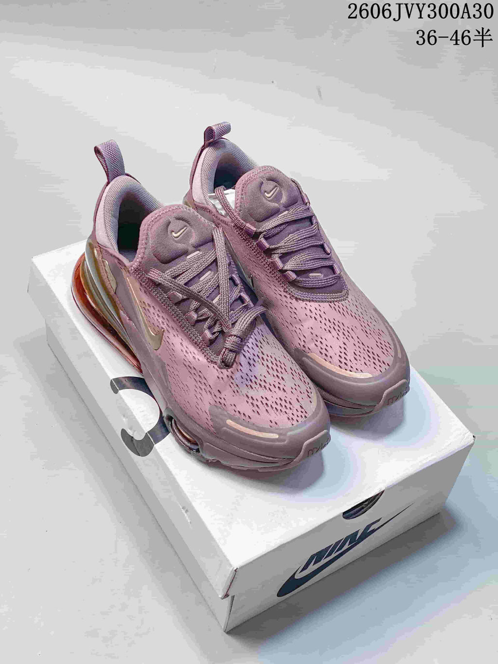 Pair of mauve Nike Air Max 270 sneakers shown from the front and side