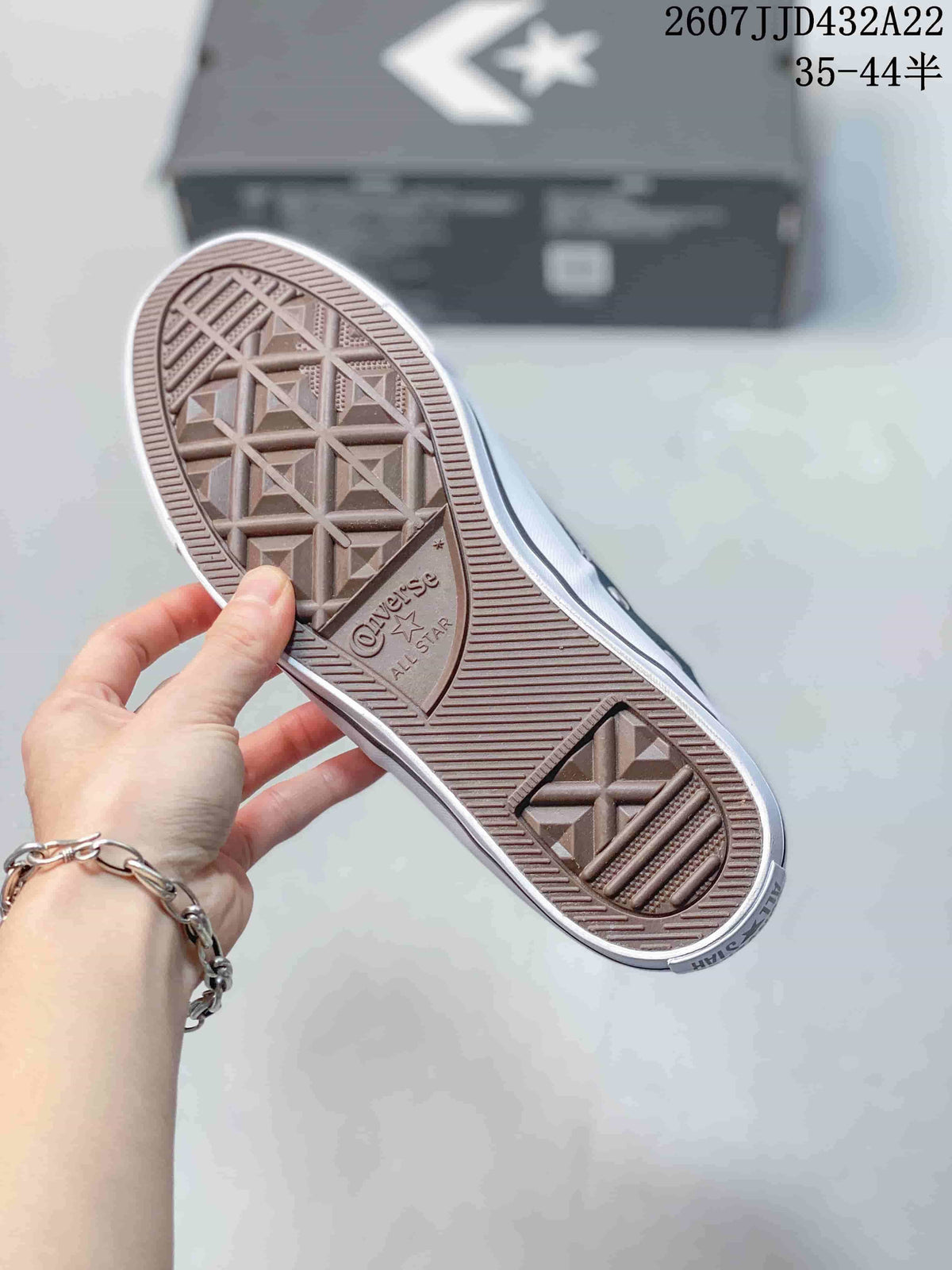 Close-up of the textured rubber outsole with Converse All Star branding.