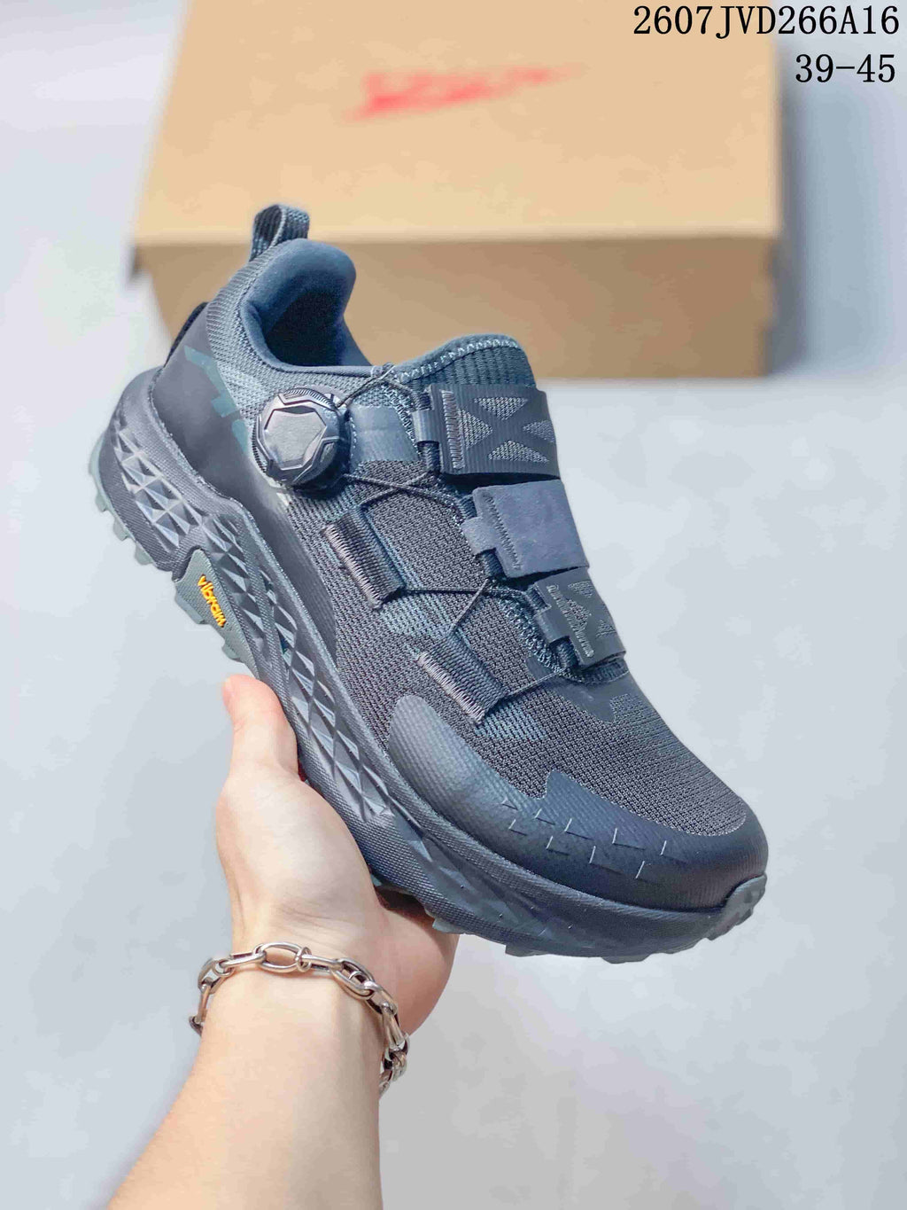 Three-quarter view of one dark gray Altra Timp 5 BOA shoe showing the dial closure, strap system, textured midsole, and lugged outsole.