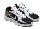 Close view of the black and white Nike Sabrina shoes with red-accented side logos