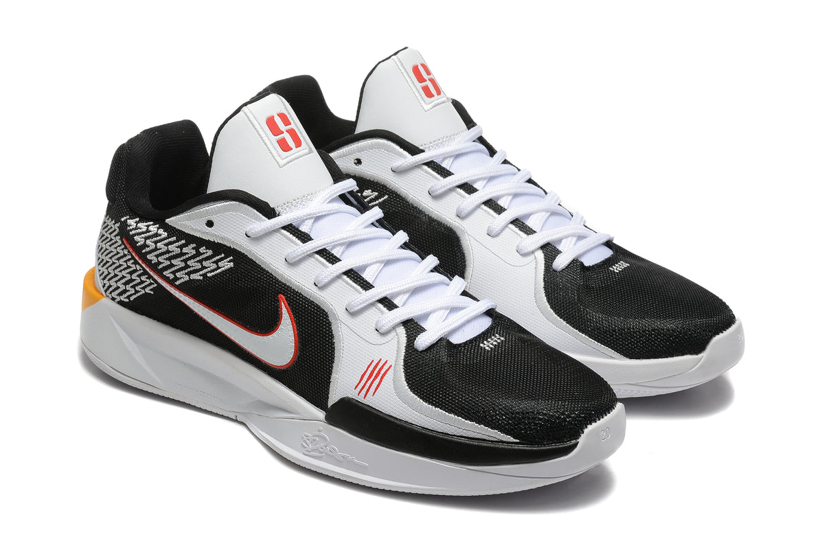 Close view of the black and white Nike Sabrina shoes with red-accented side logos