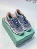 Black and gray Lacoste sneakers displayed on a green shoe box, with the model code and size range visible at the top.