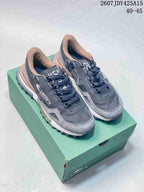 Black and gray Lacoste sneakers displayed on a green shoe box, with the model code and size range visible at the top.