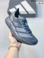 Angled side view showing the dark gray upper, layered side panels, lace-up construction, and black outsole.