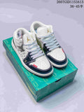 Pair of white and dark navy Nike SB Dunk Low sneakers displayed on a green presentation box.